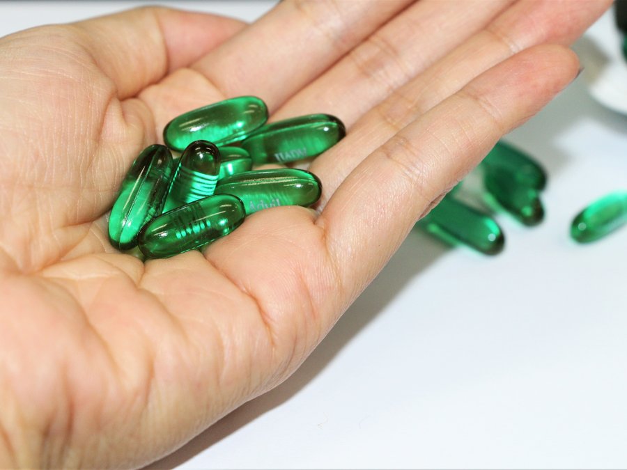 Softgel capsules held in an open hand
