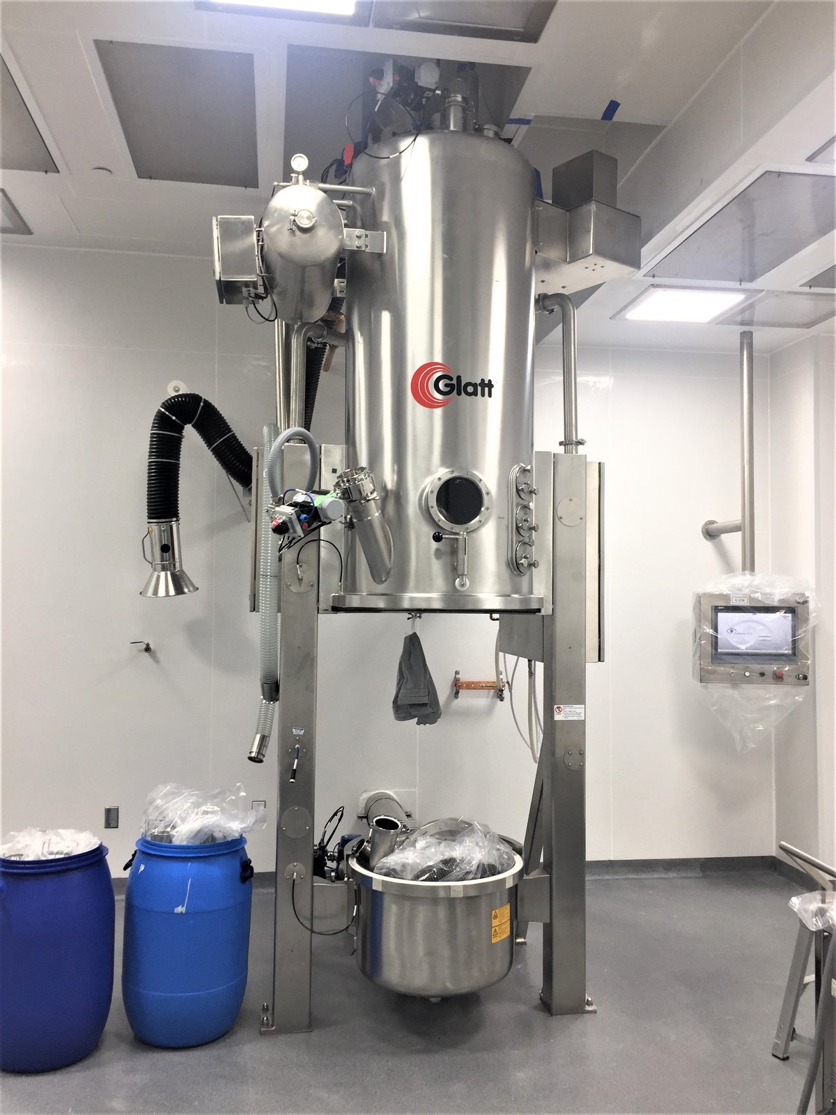 Processing equipment with local exhaust in a manufacturing suite