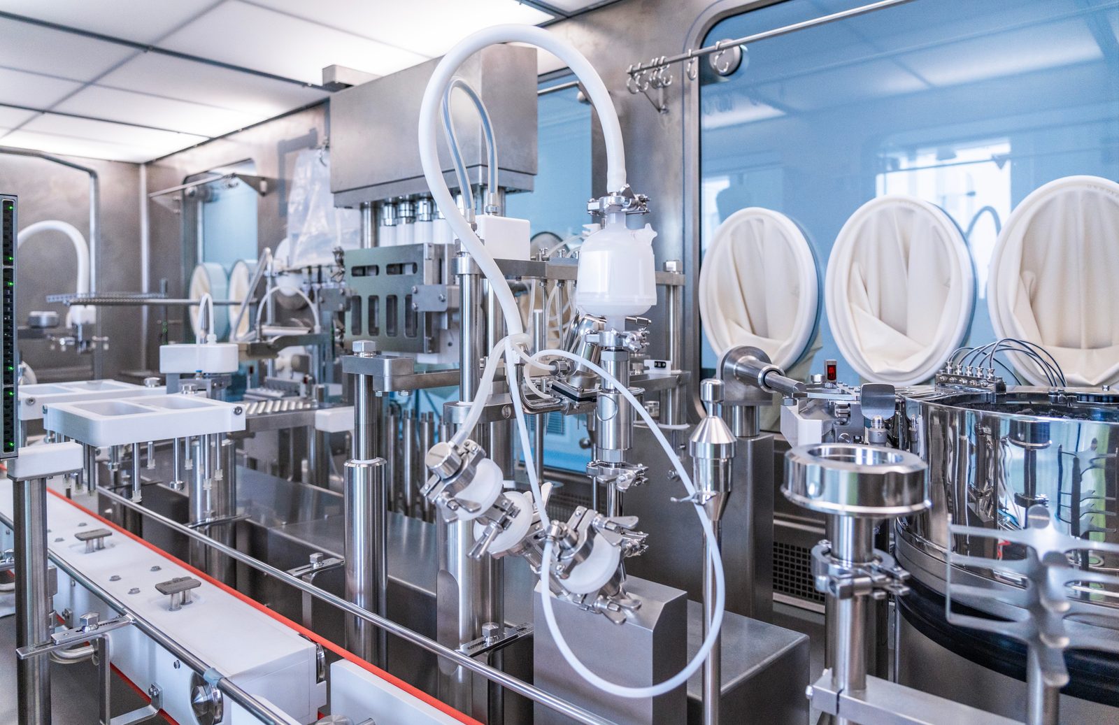 Aseptic filling line enclosed in a barrier isolator, confidential sterile injectable facility
